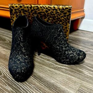 Beautiful gold booties with a black lace layover